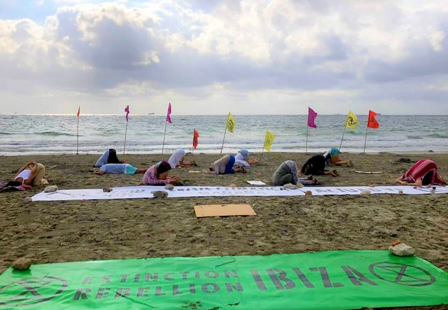 Photograph of action, rebels with their heads in thesand.